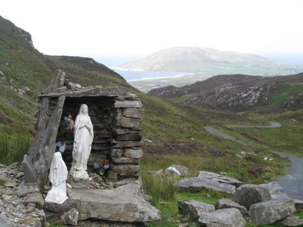 The centre of Mamore gap, looking down into Urris. The shrine is part of a larger structure that marks the location of St Eigne's Well, one of the famous Holy Wells of Ireland.