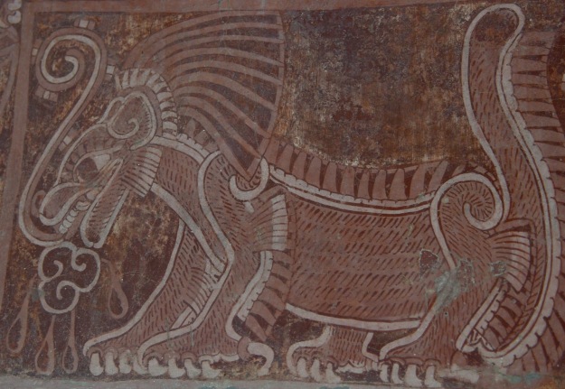 A mural of the Netted Jaguar. The line coming from the mouth is a "speech scroll", indication that the jaguar is speaking. The marks on the scroll would indicate the tone of voice or type of speech.